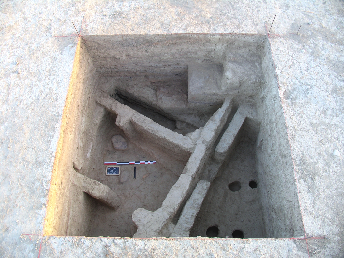 Portions of Houses 7 and 8. Note the pits dug into an early floor of House 8, perhaps for storage purposes. The closely spaced but nonetheless separate walls of the two houses – the southeastern wall of House 7 and the northwestern wall of House 8 – are a typical feature of the Aeneolithic building practices in Monjukli Depe.