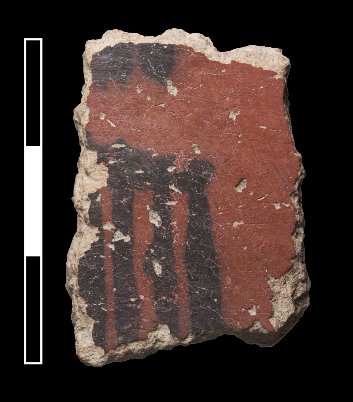 A sherd of Neolithic Black on Red ware. This ware occurs in small quantities at Monjukli Depe and is mostly intrusive in later (Meana Horizon) contexts. 