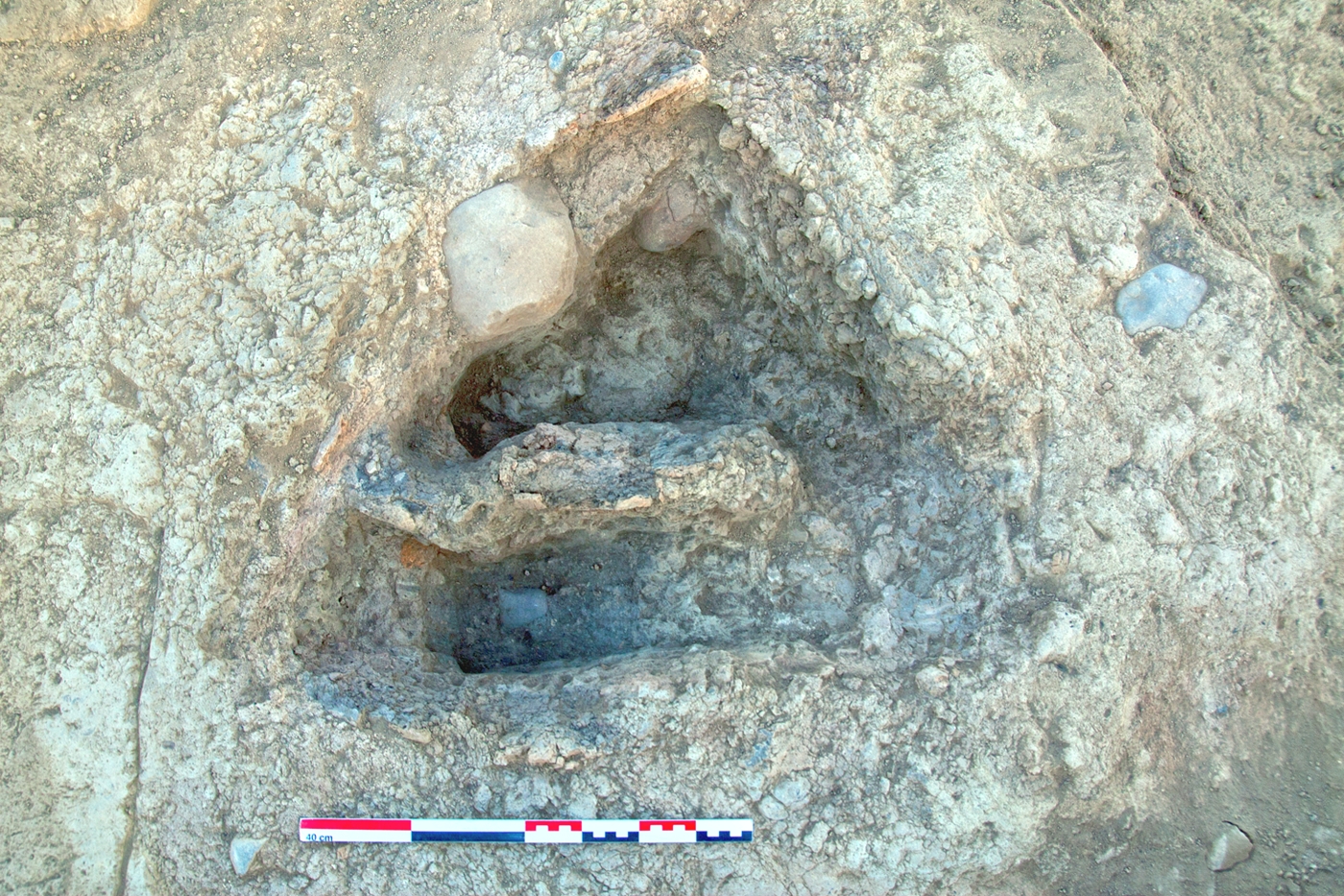 A small, double-chambered oven or hearth, FI 37. It was situated in a narrow corridor between buildings.