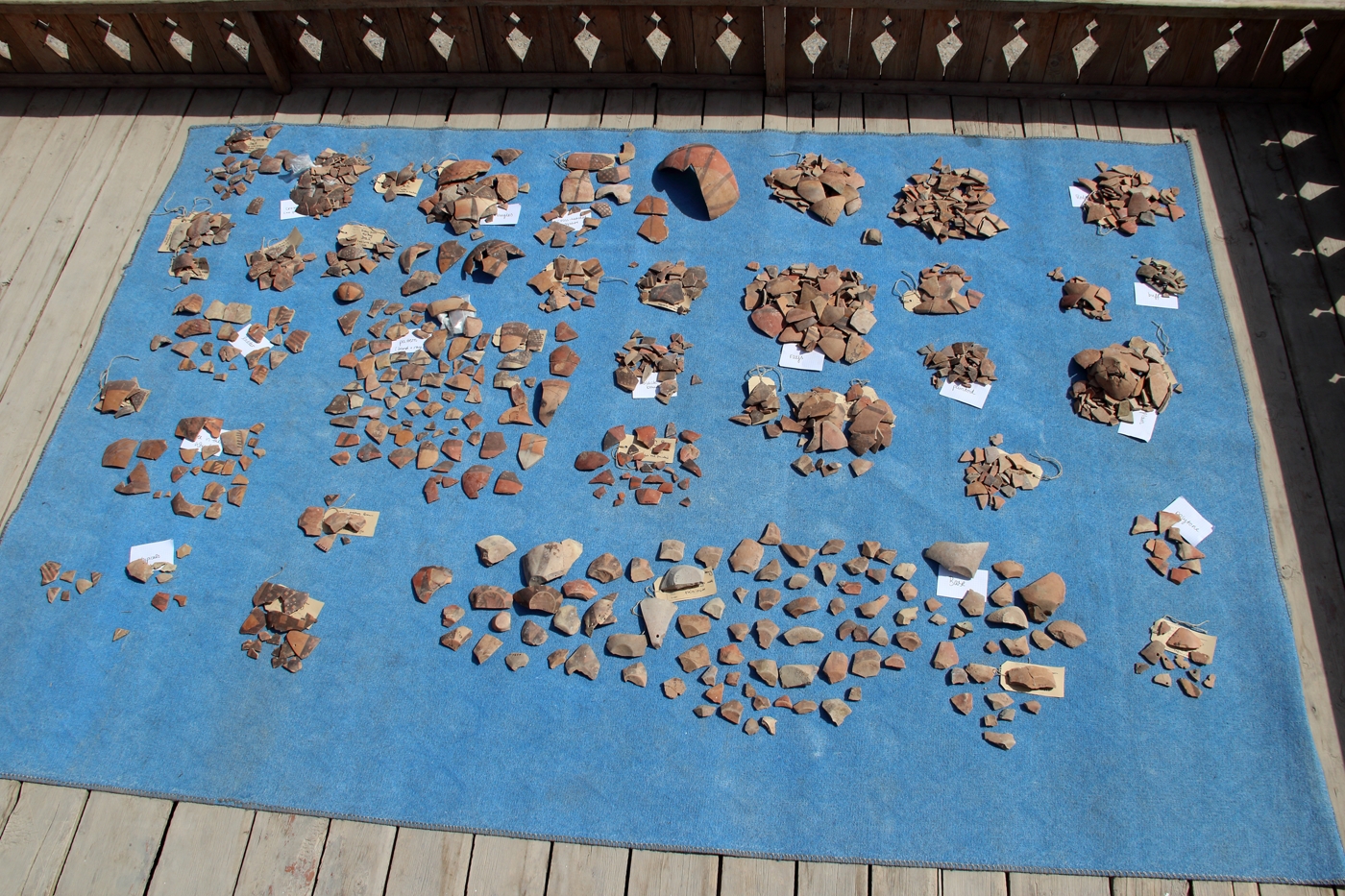 Diagnostic Meana Horizon sherds laid out for refitting.