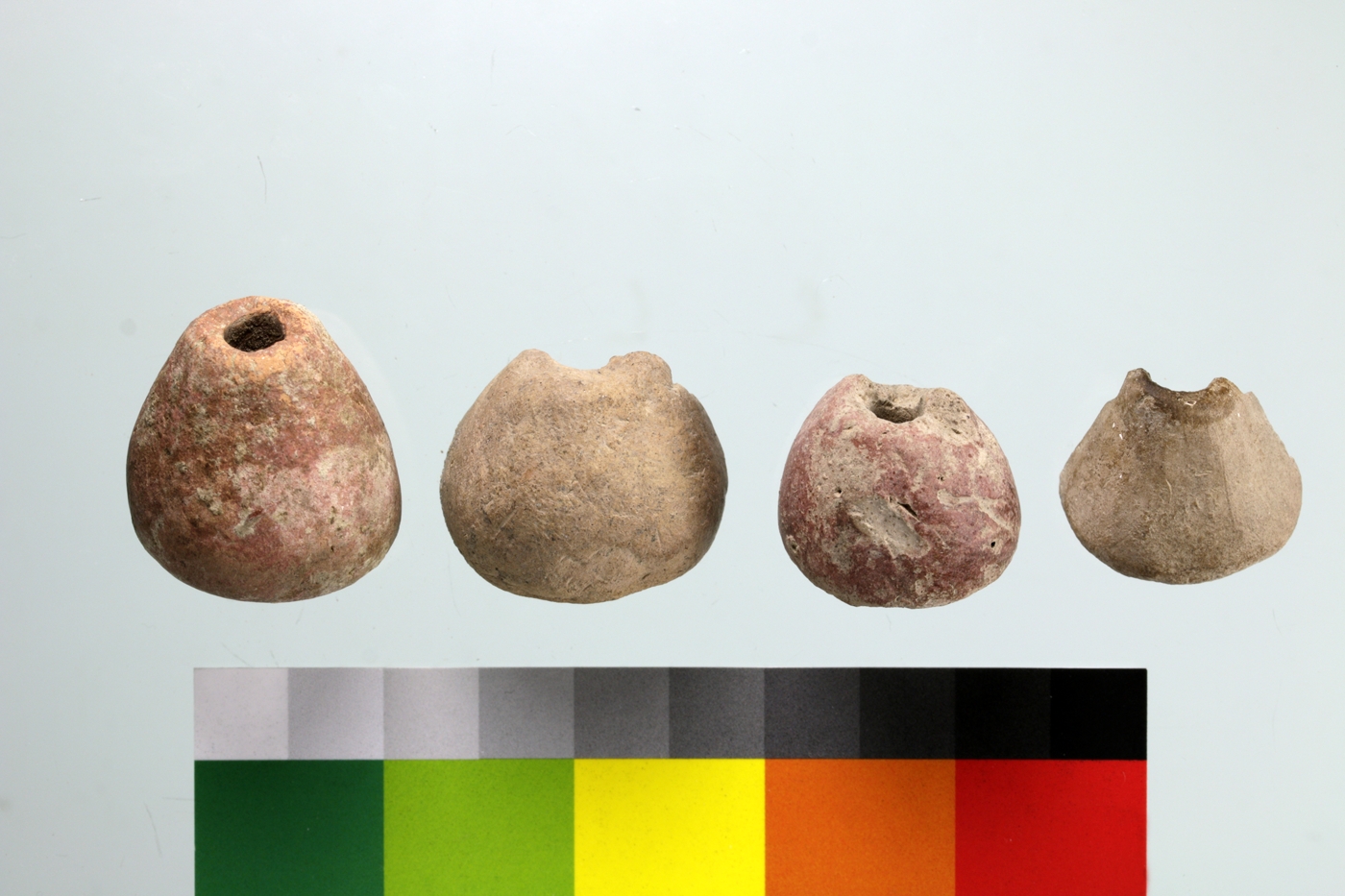 Conical spindle whorls showing variation in size and shape. Note that they are not always symmetrical