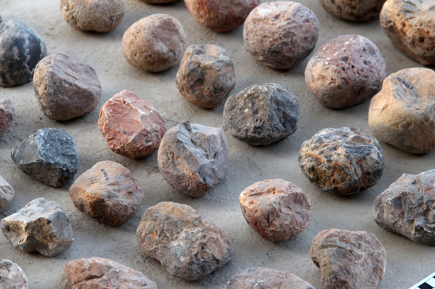 An array of hammerstones made of different materials